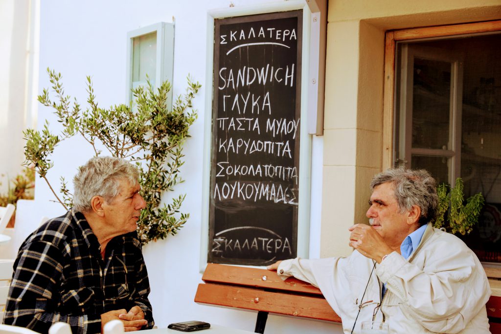 Locals chatting in Greece, Kthera island, 2 old greek men on a Saturday morning having a coffee