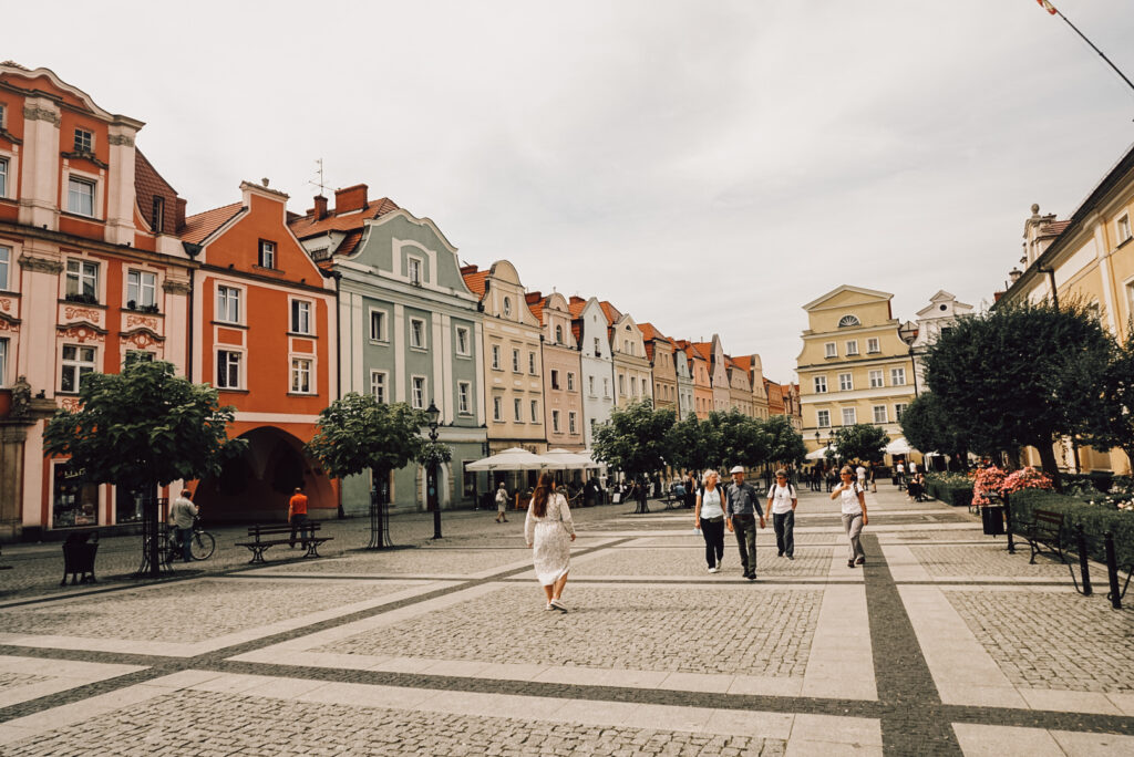 Girl walking over the market square in Boleslawiec, Poland